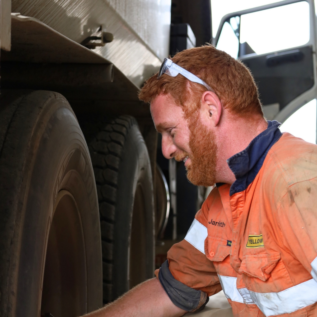 Heavy vehicle Mechanic inspecting truck